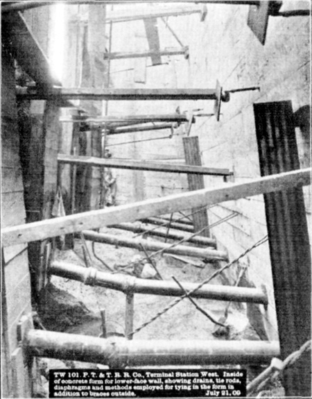 Plate LII, Fig. 4.&mdash; TW 101. P.T. & T.R.R. Co. Terminal Station West. Inside of concrete form for lower-face wall, showing drains, tie rods, diaphragms and methods employed for tying in the form in addition to braces outside. July 21, 09.