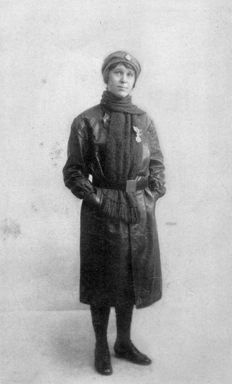 HILDA in her motor-ambulance uniform wearing the "Order of Leopold II,"
conferred on her by King Albert in person.
