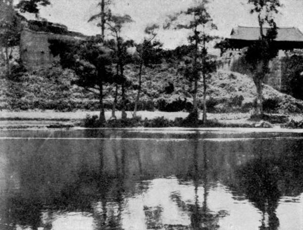 A CITY GATE AND PARTS OF THE WALL AND MOAT, AS SEEN FROM
THE "CITY OF THE DEAD," CANTON.