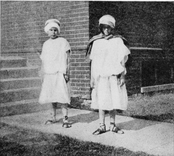 Fig. 26.&mdash;Costumes, showing sandals made by the children