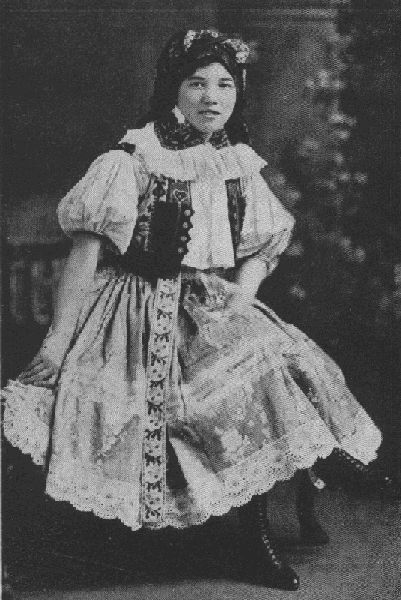 IT'S A LONG WAY FROM THIS ELABORATE CZECHO-SLOVAK COSTUME TO THE
MODERN AMERICAN STYLES